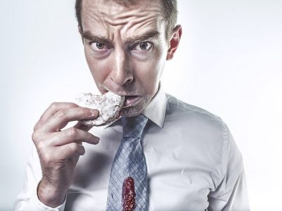 a man eating a donut