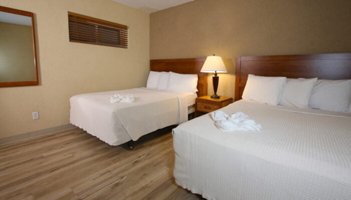 two beds in a spacious room at Crusader resort